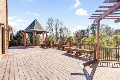 Experience luxury and privacy on over an acre in Mooresville's on Mallard Head Country Club in North Carolina - for sale on GolfHomes.com, golf home, golf lot
