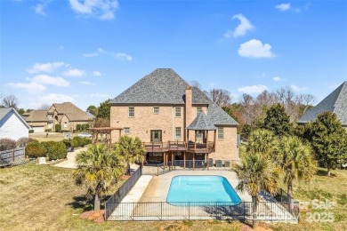 Experience luxury and privacy on over an acre in Mooresville's on Mallard Head Country Club in North Carolina - for sale on GolfHomes.com, golf home, golf lot