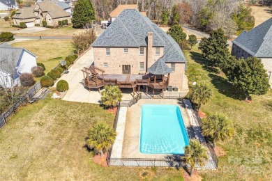 Experience luxury and privacy on over an acre in Mooresville's on Mallard Head Country Club in North Carolina - for sale on GolfHomes.com, golf home, golf lot