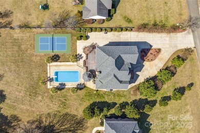 Experience luxury and privacy on over an acre in Mooresville's on Mallard Head Country Club in North Carolina - for sale on GolfHomes.com, golf home, golf lot