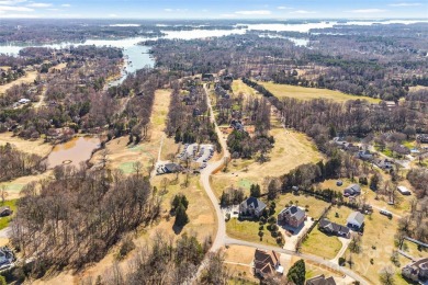 Experience luxury and privacy on over an acre in Mooresville's on Mallard Head Country Club in North Carolina - for sale on GolfHomes.com, golf home, golf lot