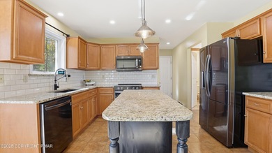 WELCOME TO 104 WOLF HOLLOW RD, A GOLF LOVERS DREAM!! Situated on Split Rock Resort and Country Club in Pennsylvania - for sale on GolfHomes.com, golf home, golf lot