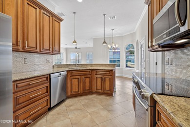 Discover refined luxury in the exclusive gated community of on Jacksonville Golf and Country Club in Florida - for sale on GolfHomes.com, golf home, golf lot