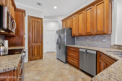 Discover refined luxury in the exclusive gated community of on Jacksonville Golf and Country Club in Florida - for sale on GolfHomes.com, golf home, golf lot