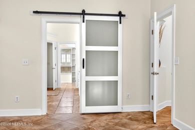 Discover refined luxury in the exclusive gated community of on Jacksonville Golf and Country Club in Florida - for sale on GolfHomes.com, golf home, golf lot