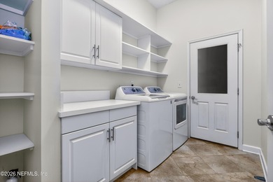 Discover refined luxury in the exclusive gated community of on Jacksonville Golf and Country Club in Florida - for sale on GolfHomes.com, golf home, golf lot