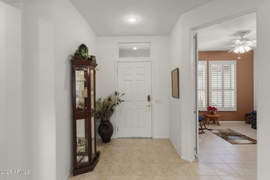 Welcoming one-owner home featuring a charming front courtyard on Sun City Grand Golf Couse and Club in Arizona - for sale on GolfHomes.com, golf home, golf lot