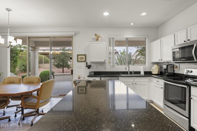 Welcoming one-owner home featuring a charming front courtyard on Sun City Grand Golf Couse and Club in Arizona - for sale on GolfHomes.com, golf home, golf lot