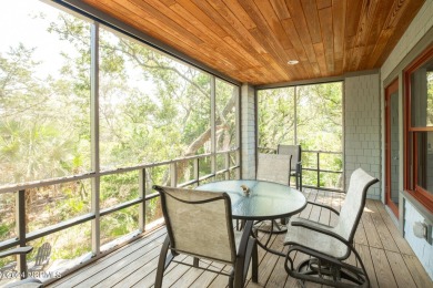 This 4BR, 3.5BA reverse floorplan tucked among mature oaks has on Bald Head Island Golf Club in North Carolina - for sale on GolfHomes.com, golf home, golf lot