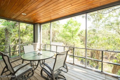 This 4BR, 3.5BA reverse floorplan tucked among mature oaks has on Bald Head Island Golf Club in North Carolina - for sale on GolfHomes.com, golf home, golf lot