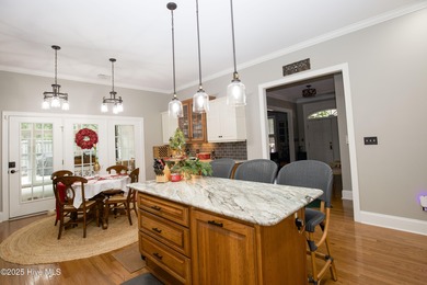 Nestled 8 miles from Pinehurst Resort and 13 miles from downtown on Foxfire Golf and Country Club in North Carolina - for sale on GolfHomes.com, golf home, golf lot