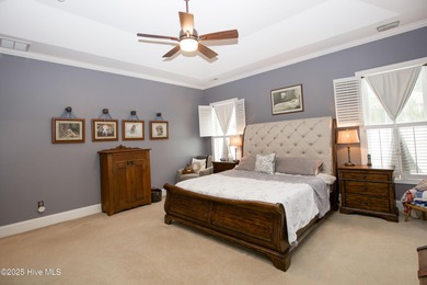 Nestled 8 miles from Pinehurst Resort and 13 miles from downtown on Foxfire Golf and Country Club in North Carolina - for sale on GolfHomes.com, golf home, golf lot