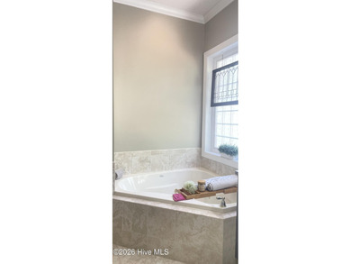 Nestled 8 miles from Pinehurst Resort and 13 miles from downtown on Foxfire Golf and Country Club in North Carolina - for sale on GolfHomes.com, golf home, golf lot