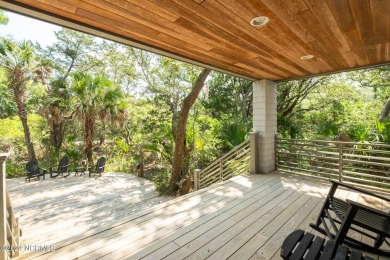 This 4BR, 3.5BA reverse floorplan tucked among mature oaks has on Bald Head Island Golf Club in North Carolina - for sale on GolfHomes.com, golf home, golf lot