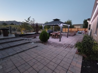 Live where comfort meets golf course views! This 4-bedroom on Toana Vista Golf Course in Nevada - for sale on GolfHomes.com, golf home, golf lot