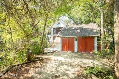 This 4BR, 3.5BA reverse floorplan tucked among mature oaks has on Bald Head Island Golf Club in North Carolina - for sale on GolfHomes.com, golf home, golf lot