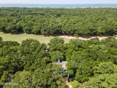 This 4BR, 3.5BA reverse floorplan tucked among mature oaks has on Bald Head Island Golf Club in North Carolina - for sale on GolfHomes.com, golf home, golf lot