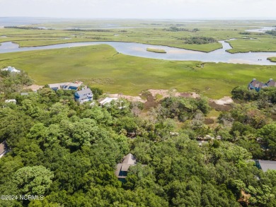 This 4BR, 3.5BA reverse floorplan tucked among mature oaks has on Bald Head Island Golf Club in North Carolina - for sale on GolfHomes.com, golf home, golf lot