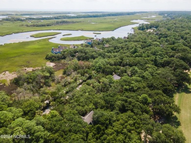 This 4BR, 3.5BA reverse floorplan tucked among mature oaks has on Bald Head Island Golf Club in North Carolina - for sale on GolfHomes.com, golf home, golf lot