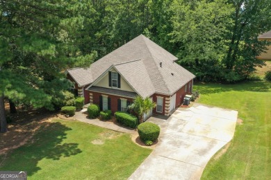 Welcome to this stately 4 bedroom, 2.5 bathroom traditional on Canongate At Georgia National Golf Club in Georgia - for sale on GolfHomes.com, golf home, golf lot