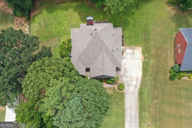 Welcome to this stately 4 bedroom, 2.5 bathroom traditional on Canongate At Georgia National Golf Club in Georgia - for sale on GolfHomes.com, golf home, golf lot