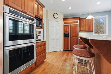 Nestled on a private, wooded half-acre cul-de-sac in the on Polo Fields Golf and Country Club in Michigan - for sale on GolfHomes.com, golf home, golf lot