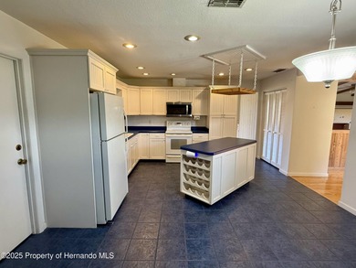 Unique 4-Bedroom Home on the Golf Course Of Ridge Manor Country on The Ridge Manor Oaks Golf and Country Club in Florida - for sale on GolfHomes.com, golf home, golf lot