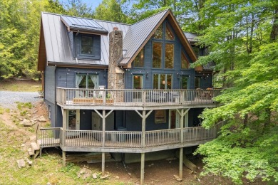 Prepare to fall in love with this beautifully updated mountain on Wolf Laurel Country Club in North Carolina - for sale on GolfHomes.com, golf home, golf lot
