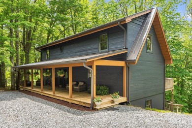 Prepare to fall in love with this beautifully updated mountain on Wolf Laurel Country Club in North Carolina - for sale on GolfHomes.com, golf home, golf lot