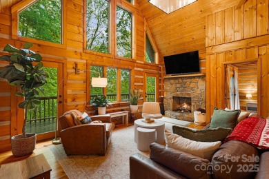 Prepare to fall in love with this beautifully updated mountain on Wolf Laurel Country Club in North Carolina - for sale on GolfHomes.com, golf home, golf lot