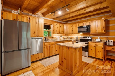 Prepare to fall in love with this beautifully updated mountain on Wolf Laurel Country Club in North Carolina - for sale on GolfHomes.com, golf home, golf lot