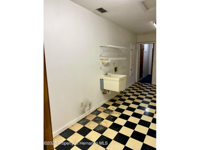 Unique 4-Bedroom Home on the Golf Course Of Ridge Manor Country on The Ridge Manor Oaks Golf and Country Club in Florida - for sale on GolfHomes.com, golf home, golf lot