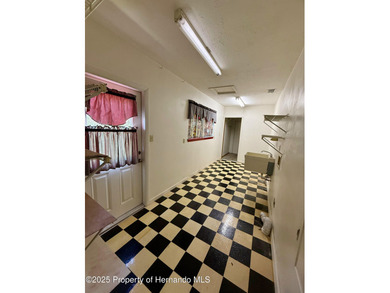 Unique 4-Bedroom Home on the Golf Course Of Ridge Manor Country on The Ridge Manor Oaks Golf and Country Club in Florida - for sale on GolfHomes.com, golf home, golf lot