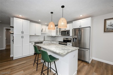 This beautifully designed and updated ranch residence features 2 on Ohio Prestwick Country Club in Ohio - for sale on GolfHomes.com, golf home, golf lot