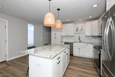 This beautifully designed and updated ranch residence features 2 on Ohio Prestwick Country Club in Ohio - for sale on GolfHomes.com, golf home, golf lot