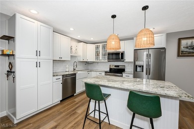 This beautifully designed and updated ranch residence features 2 on Ohio Prestwick Country Club in Ohio - for sale on GolfHomes.com, golf home, golf lot