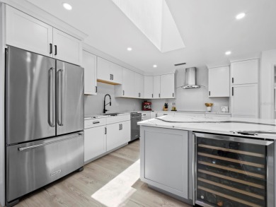 Located in the quiet, gated community of Bay Isles on Longboat on Longboat Key Golf Club Resort in Florida - for sale on GolfHomes.com, golf home, golf lot