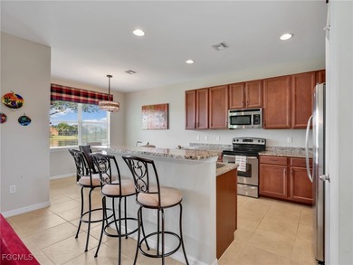 Discover exceptional living in this stunning two-story residence on Valencia Golf and Country Club in Florida - for sale on GolfHomes.com, golf home, golf lot