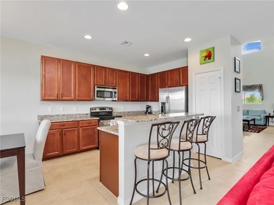 Discover exceptional living in this stunning two-story residence on Valencia Golf and Country Club in Florida - for sale on GolfHomes.com, golf home, golf lot