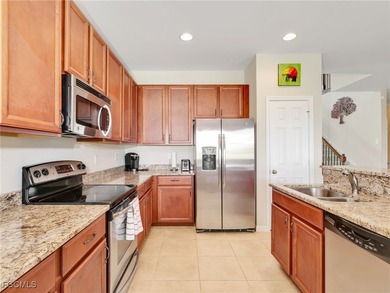 Discover exceptional living in this stunning two-story residence on Valencia Golf and Country Club in Florida - for sale on GolfHomes.com, golf home, golf lot