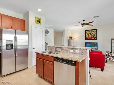 Discover exceptional living in this stunning two-story residence on Valencia Golf and Country Club in Florida - for sale on GolfHomes.com, golf home, golf lot