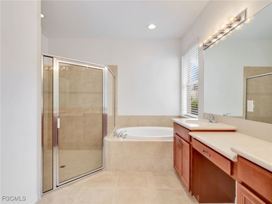 Discover exceptional living in this stunning two-story residence on Valencia Golf and Country Club in Florida - for sale on GolfHomes.com, golf home, golf lot