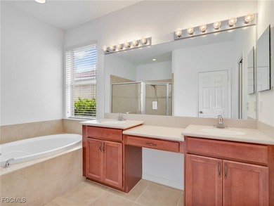 Discover exceptional living in this stunning two-story residence on Valencia Golf and Country Club in Florida - for sale on GolfHomes.com, golf home, golf lot