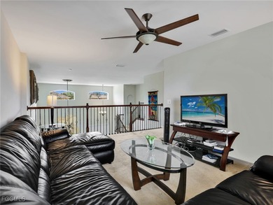 Discover exceptional living in this stunning two-story residence on Valencia Golf and Country Club in Florida - for sale on GolfHomes.com, golf home, golf lot