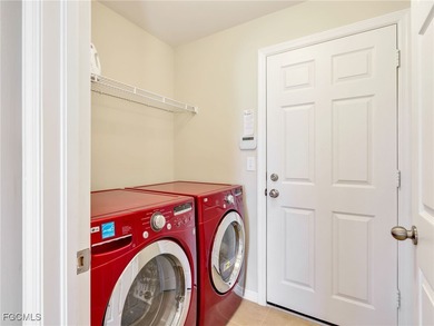 Discover exceptional living in this stunning two-story residence on Valencia Golf and Country Club in Florida - for sale on GolfHomes.com, golf home, golf lot