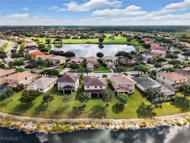 Discover exceptional living in this stunning two-story residence on Valencia Golf and Country Club in Florida - for sale on GolfHomes.com, golf home, golf lot