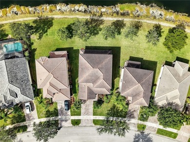 Discover exceptional living in this stunning two-story residence on Valencia Golf and Country Club in Florida - for sale on GolfHomes.com, golf home, golf lot