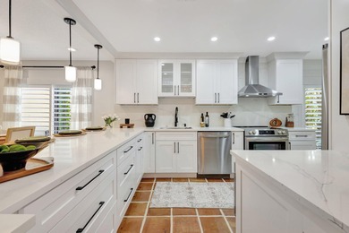 This exceptional residence has been completely reimagined with a on Hunters Run Golf and Country Club in Florida - for sale on GolfHomes.com, golf home, golf lot