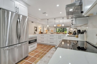 This exceptional residence has been completely reimagined with a on Hunters Run Golf and Country Club in Florida - for sale on GolfHomes.com, golf home, golf lot