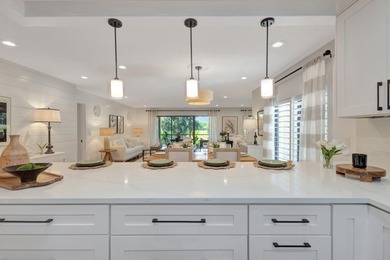 This exceptional residence has been completely reimagined with a on Hunters Run Golf and Country Club in Florida - for sale on GolfHomes.com, golf home, golf lot